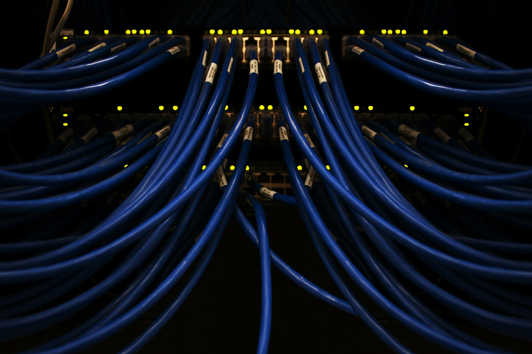 Mesh router and ethernet cables on a media cabinet